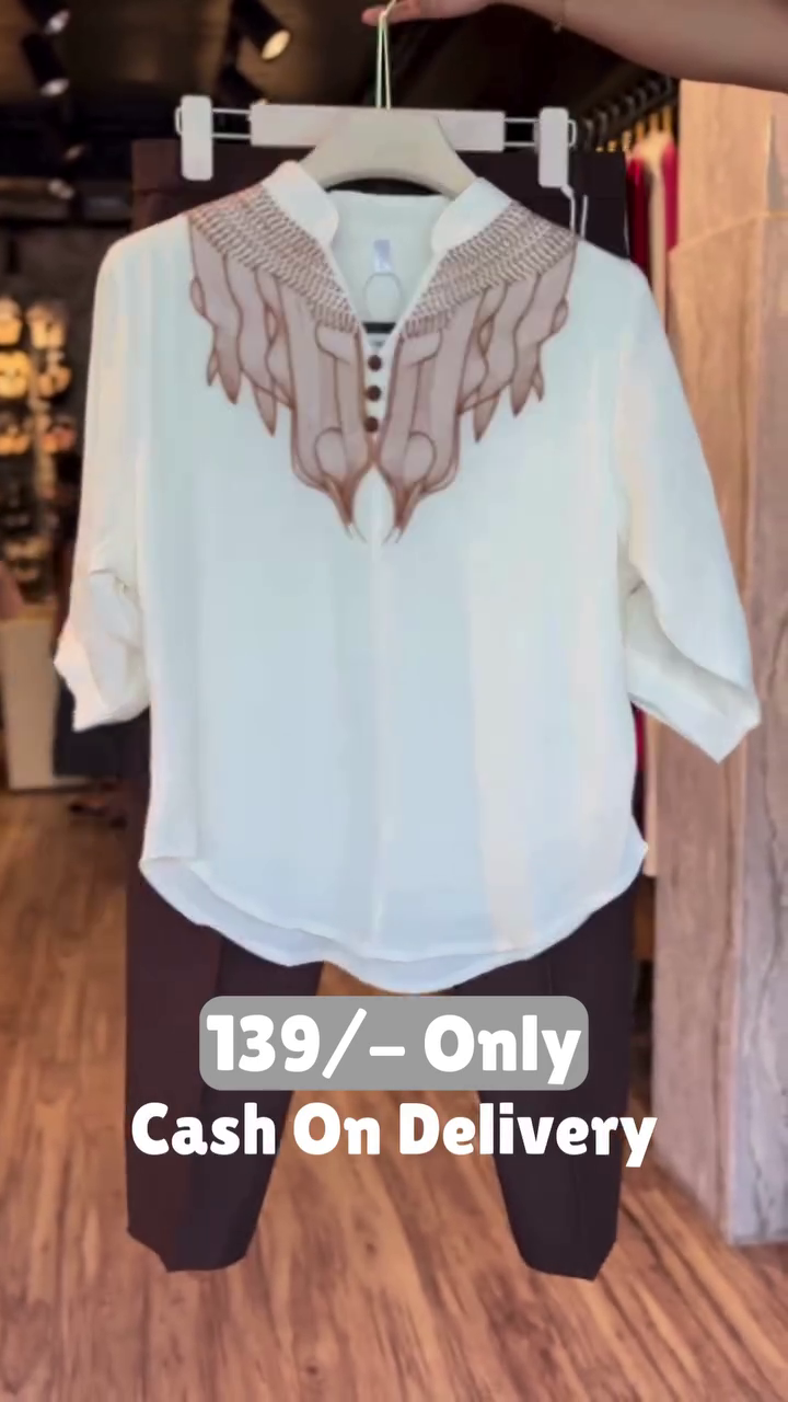 Elegant White Embroidered Top with Black Pants – Minimal Chic Style